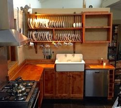 Another shot of the same kitchen, showing the butler sink, dish-rack and CookBook repository